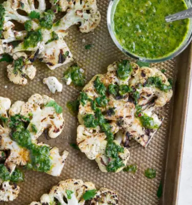 Cauliflower Steaks with Lemon Olive Oil and Parsley Pistachio Topping Recipe