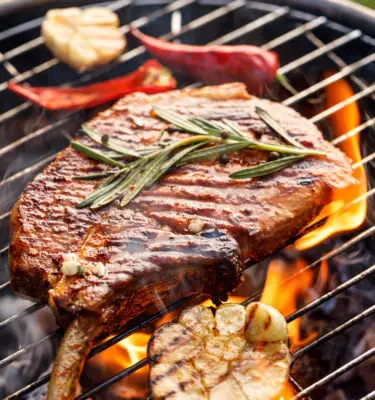 Grilled Beer-Marinated Pork Chops with Garlic Infused Oil Olive Blue Cheese Topping Recipe