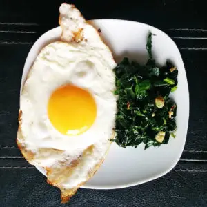 EVOO Fried Eggs with Sautéed Garlic Kale Recipe