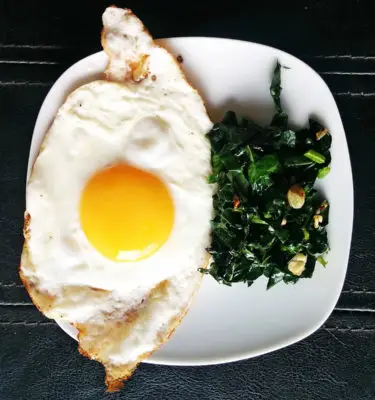 EVOO Fried Eggs with Sautéed Garlic Kale Recipe