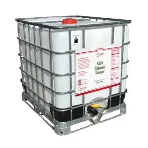 A large 275-gallon caged IBC tote filled with original white balsamic vinegar